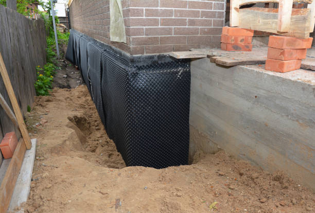 Happy homeowners after waterproofing job in Mullica Hill